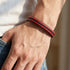 BLOODY MARY Rot schwarzes Lederarmband für Herren im Casual Look mit geflochtener Struktur am Handgelenk mit Gravur von niqal