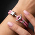 Maritimes Herrenarmband mit Edelstahl Anker Anhänger und geflochtenem rosa Lederband
