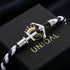 Maritimes Herrenarmband mit Anker Motiv aus Edelstahl und geflochtenem blau weißem Segeltau