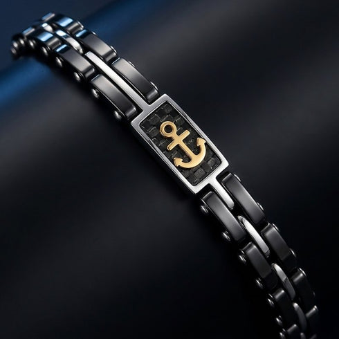 ANCORA uniqal Edelstahlarmband mit Carbonfaser-Inlay und goldenem Anker als exklusives nautisches Schmuckstück in Detailaufnahme