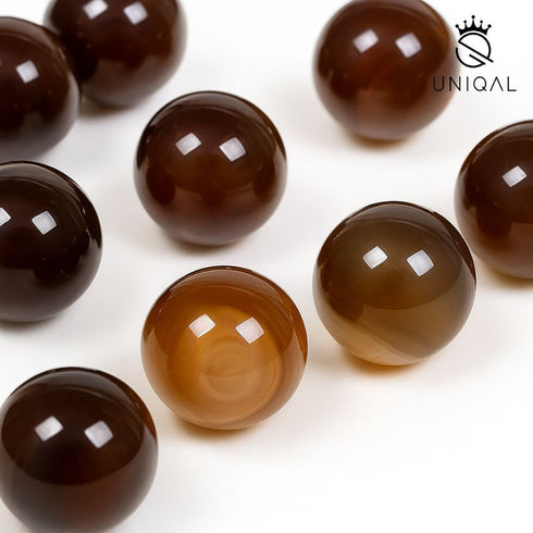 Nahaufnahme Botswana Achat Edelsteinperlen mit glänzender Oberfläche – Symbol für Harmonie, Stabilität und seelische Heilung