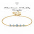 ELARA 14K GOLD von UNIQAL: Armband aus 925 Silber mit 14K-Vergoldung und fünf Moissaniten, insgesamt 0,70 Karat, auf weißem Hintergrund.