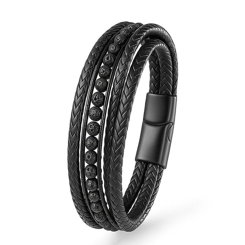 Uniqal Lava Deluxe zeigt maskuline Eleganz – getragenes Lederarmband mit natürlichen Lavasteinen am Handgelenk eines Mannes.