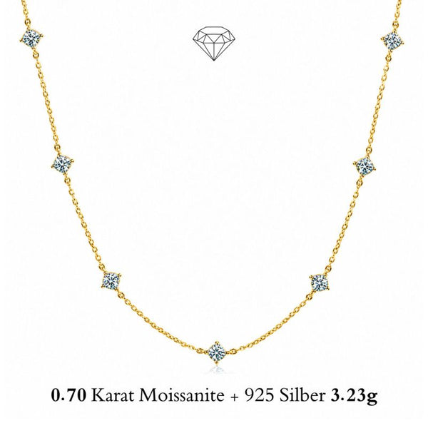 SHINE CELESTA 14K GOLD von UNIQAL: Moissanit-Halskette aus 925 Silber mit 14K-Vergoldung, sieben Steinen und insgesamt ca. 0,70 Karat auf Weiß.