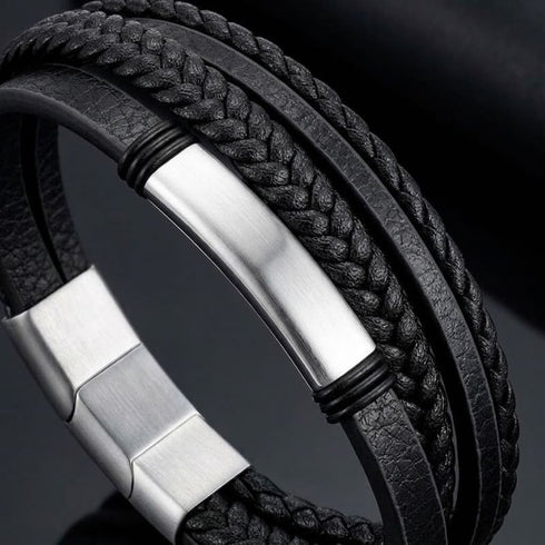 Uniqal BLACK OLIVE Armband für Männer – modernes mehrreihiges Herrenaccessoire mit schwarzem Flechtdesign und gebürsteten Metallelementen.