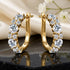 UNIQAL DIAMORA GOLD Schmuckpaar stilvoll präsentiert mit goldenem Finish als exklusive Geschenkidee für besondere Momente