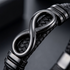 Uniqal ENDLESS BLACK Armband für Männer – modernes schwarzes Herrenaccessoire mit Infinity-Element und markanter Flechtstruktur.
