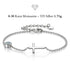 GRACE Moissanit-Armband von UNIQAL aus 925 Silber mit seitlich liegendem Kreuz, 0,30 Karat und Verlängerungskette auf weißem Hintergrund.