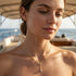 UNIQAL Damen Halskette mit goldener Unendlichkeitsform für elegante Premium und Business Looks