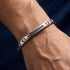UNIQAL LINEA zeitloses Designerarmband aus Edelstahl mit Roségold-Elementen und schwarzen Zirkonia im modernen Alltagsstil
