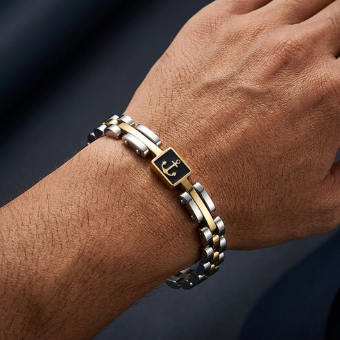 UNIQAL MARINO Unisex Armband am Handgelenk – hochwertiges 316L Edelstahl Armband mit Hämatit, goldenem Anker und silber-goldenem Design