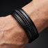 Uniqal MULTY LAYER Herrenarmband – stilvolles schwarzes Mehrfacharmband mit verschiedenen Lederstrukturen und geflochtenen Details.