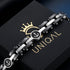 UNIQAL NAVARO Unisex Armband aus Edelstahl und Hämatit auf UNIQAL Schmuckbox mit maritimen Ankersymbolen