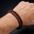 Uniqal PASSION BROWN Herrenarmband am Handgelenk – braunes Flechtleder mit glänzenden braunen Perlen für einen warmen und stilvollen Männerlook