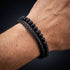 Uniqal PASSION LAVA Herrenarmband am Handgelenk – schwarzes Lederarmband mit matten Perlen und markanten Lavasteinen für einen modernen Männerlook