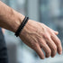 Uniqal PASSION LAVA Herrenarmband – stilvolles schwarzes Armband mit Lavastein-Perlen und geflochtenem Leder für Alltag und Freizeit