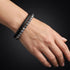 Uniqal PASSION SPECTROLITE Armband am Handgelenk – grau gemusterte Spectrolite-Perlen mit schwarzem Flechtleder für einen modernen und eleganten Look