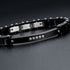 UNIQAL REGIO modernes Unisex Armband mit schwarzer Gliederstruktur, Naturholz und funkelnden Schmucksteinen