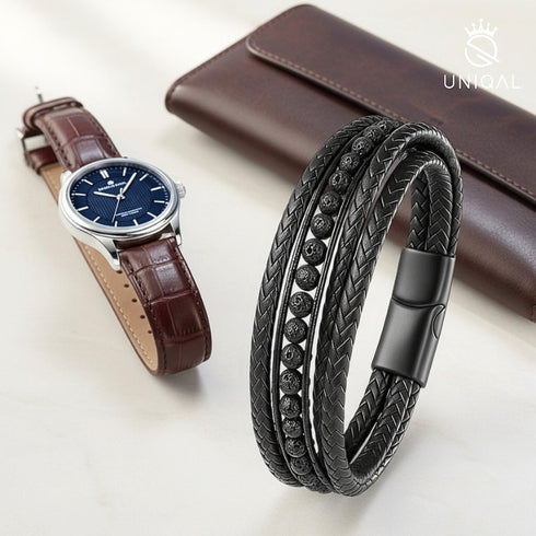 Schwarzes Uniqal Lava Deluxe Schmuckstück neben Uhr und Brieftasche – Symbol für Stilbewusstsein und Charakter.