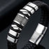 Uniqal SILVER MAMBA Herrenarmband in Detailansicht – schwarzes Flechtarmband mit glänzenden silberfarbenen Metallelementen und markantem Verschluss.