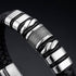 Uniqal SILVER MAMBA Armband mit Gravur – edles Herrenarmband mit schwarzem Flechtdesign und auffälligen silberfarbenen Metallakzenten.
