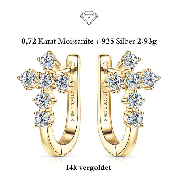 VERA 14K GOLD von UNIQAL: Kreuzohrringe aus 925 Silber mit 14K-Goldplattierung und insgesamt 0,72 Karat Moissanit, paarweise auf weißem Hintergrund.